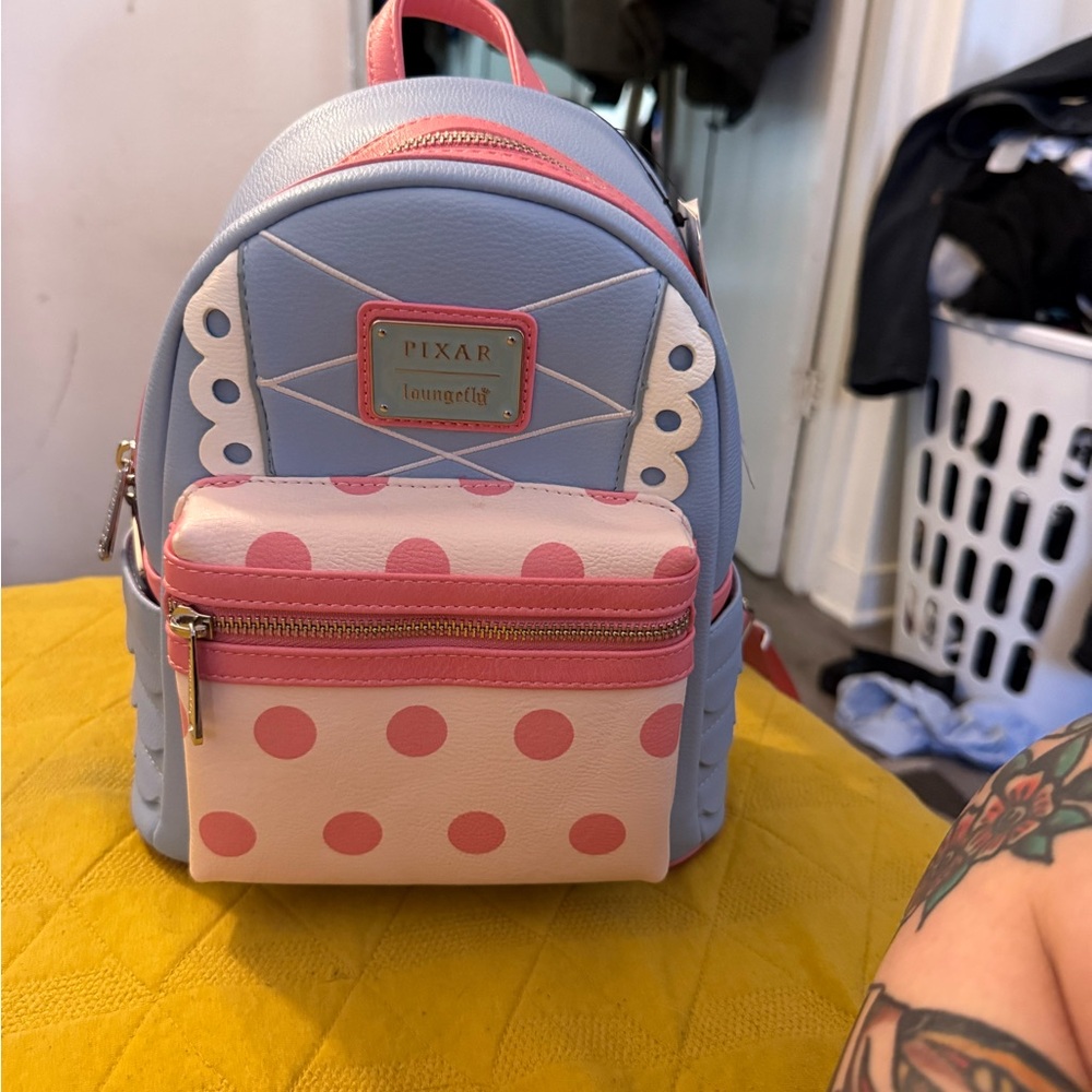 Loungefly Pixar Blue and Pink Backpack
